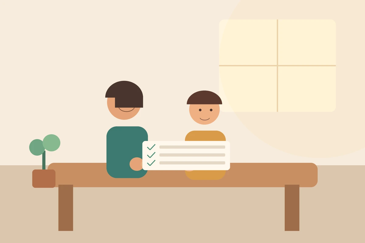 Parent and child making a calm family plan together at a warm kitchen table